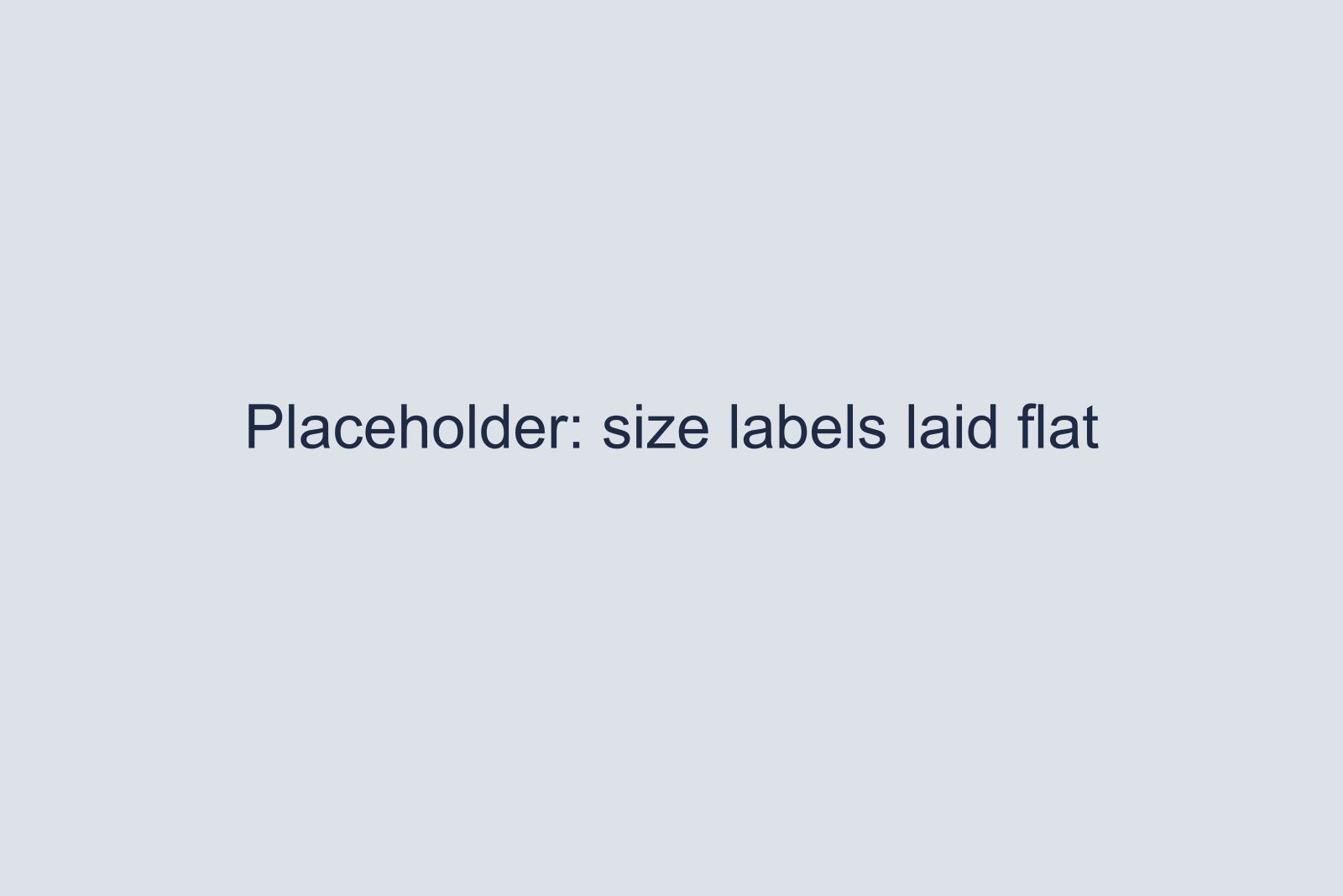 Placeholder for three shirt size labels laid flat on a table